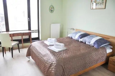 a bedroom with a bed with two towels on it at Kościuszki 28 A by Homeprime in Kraków
