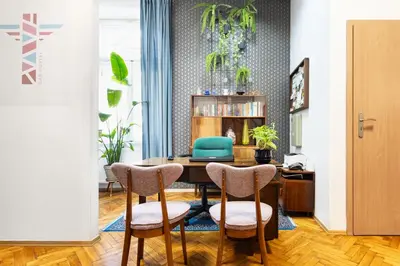 a dining room with a table and two chairs at Das Hostel in Kraków