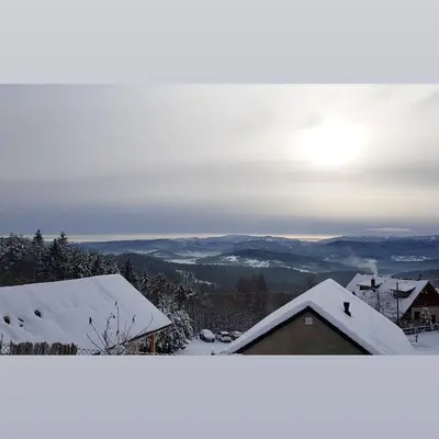 a view of a snow covered roof of a house at Podbucznik 1 Pilsko in Targoszów