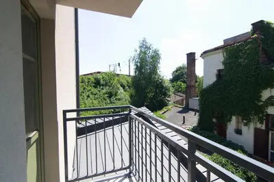 a balcony with a view of a street at Tweety Cracow House in the Old Town in Kraków