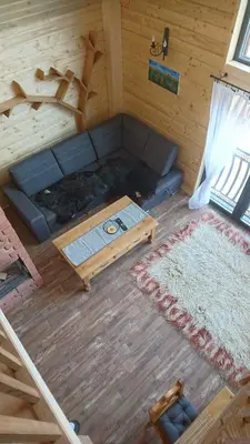 an overhead view of a living room with a couch and a table at Stodoła Simonka na punkcie widokowym in Zawoja