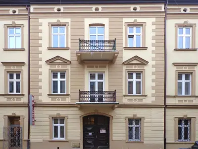 a building with balconies on the side of it at Apartamenty Idylla in Kraków