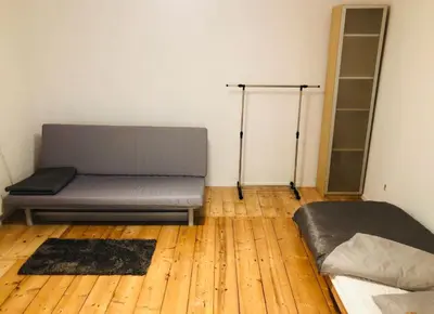 a room with a bed and shelves in a room at Apartment in Ivy covered house, near Old Town in Kraków