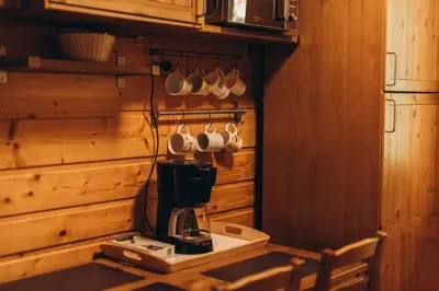 a kitchen with a coffee maker on a counter at Mountain Cottage Lubomierz in Lubomierz