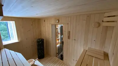 an inside view of a sauna with a window at Mountain Cottage Lubomierz in Lubomierz