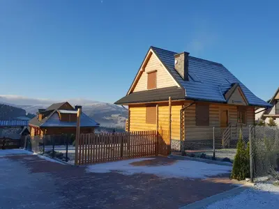 a house with a fence in front of it at Zawoja hrabkowa Jastrzębowka in Zawoja