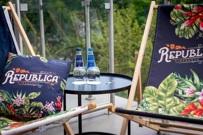 a couple of bottles of water sitting on a table at Focus Hotel Premium Kraków in Kraków