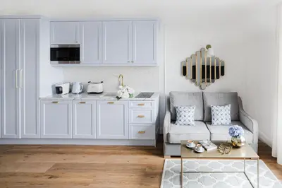 a living room with a couch and a table at Apartament Golden Place 2 in Kraków