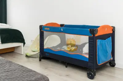 a childs play cart in a bedroom at Bella Casa Premium Apartment - 104 Kobierzynska in Kraków
