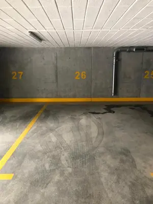 an empty parking garage with numbers on the wall at Bella Casa Premium Apartment - 104 Kobierzynska in Kraków