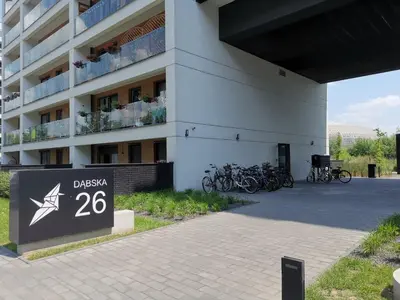 a building with bikes parked in front of it at Apartament Kraków Arena in Kraków