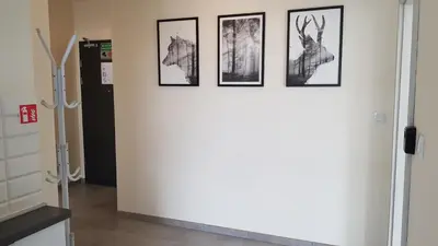 a group of four pictures hanging on a wall at Apartament Kraków Arena in Kraków