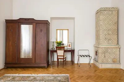a living room with a cabinet and a table at Belle Epoque I, luxury suite 50m to Main Square in Kraków