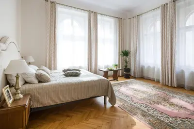 a bedroom with a large bed and a rug at Belle Epoque I, luxury suite 50m to Main Square in Kraków