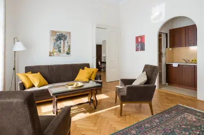 a living room with a couch and two chairs and a table at Belle Epoque I, luxury suite 50m to Main Square in Kraków