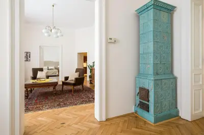 a hallway with a blue pillar in a living room at Belle Epoque II, luxury suite 50m to Main Square in Kraków