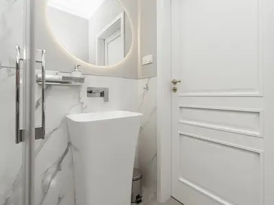a white bathroom with a sink and a mirror at Luxury Gold Cracow City Centre 3min Main Sq Old Town in Kraków