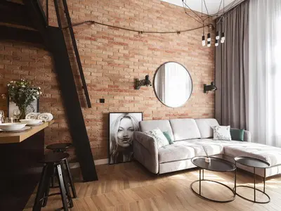 a living room with a white couch and a brick wall at Loft Apartment Cracow Old Town 3min Main Sq in Kraków