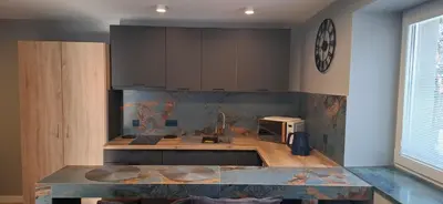 a kitchen with a sink and a counter top at Noclegi pod Brzegiem in Zawoja