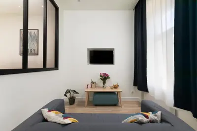 a living room with a couch and a table at Platinum Suites in Kraków
