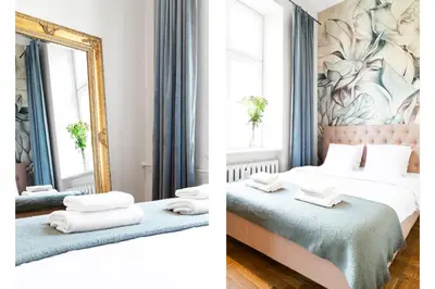 a hotel room with two beds and a mirror at HOUSEHOST Apartment: Łazarza street in Kraków