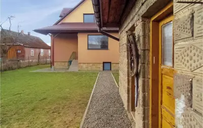 a view from the outside of a house with a yard at One-Bedroom Holiday Home In Biadoliny Szlachecki in Biadoliny Szlacaheckie