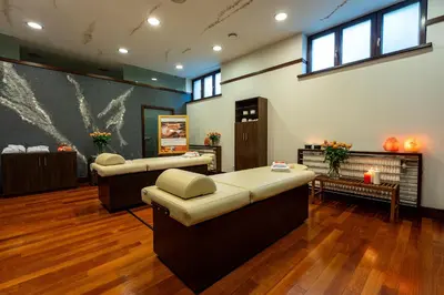 a waiting room with two couches and a fireplace at Grand Sal in Wieliczka