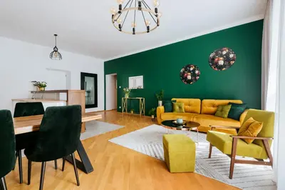 a living room with a couch and a table at Tomasza 20 Apartments in Kraków