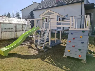 a playground with a slide and a climbing frame at Pokoje pod Baranami Zator Przeciszów in Przeciszów