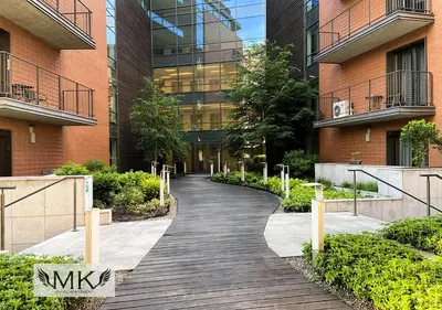 a walkway in front of a building at MK Angel Apartment in Kraków