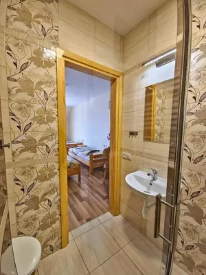 a bathroom with a sink and a mirror at U Zosi in PyzÃ³wka