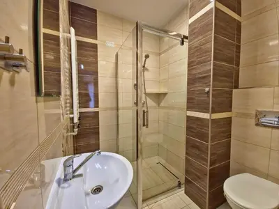 a bathroom with a sink and a shower and a toilet at U Zosi in PyzÃ³wka