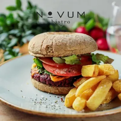 a sandwich and french fries on a plate at Discover Krakow Apartments - 3 Rakowicka St - Amazing Loft near Main Station - Netflix in Kraków