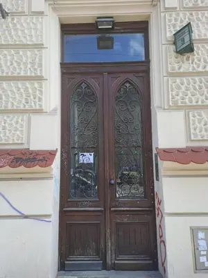 a wooden door in the side of a building at Duplex apartment in the center of Krakow in Kraków