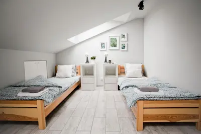 a bedroom with two beds in a room at Spokojna Apartamenty in Trzebinia