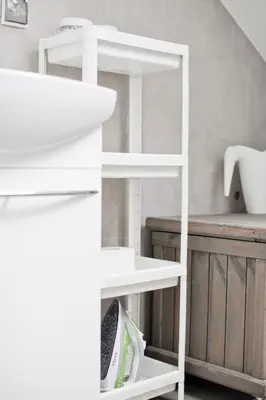 a white shelf in a kitchen next to a counter at Spokojna Apartamenty in Trzebinia