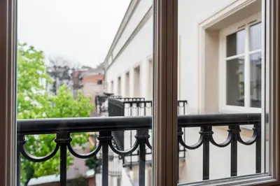 a view of a balcony from a window at Groble Residence WAWELOFTS in Kraków