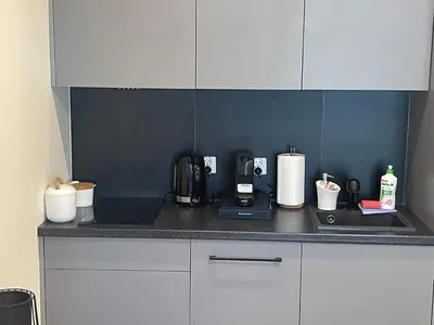 a kitchen with a counter top with a coffee maker at Rajska 3 ap 206 by Atrium Apartments in Kraków