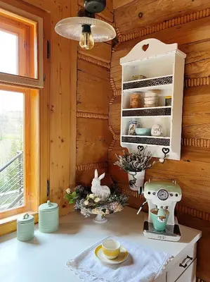 a kitchen with wooden walls and a counter with a machine at Góralskie domy w Łostówce in Łostówka