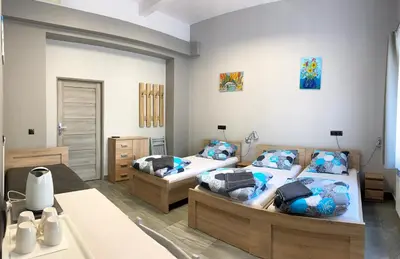 two beds in a room with two beds sidx sidx sidx sidx sidx at OLIVIA in Osiek