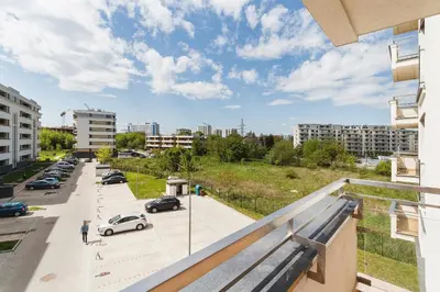 a balcony with a view of a city street at Tauron Arena Elegant Apartment Dąbska by Noclegi Renters in Kraków