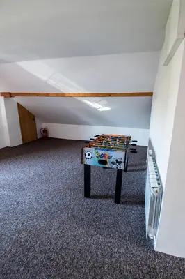 a room with a table in the middle of a room at Cracow Family House in Kraków