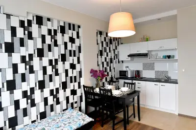 a kitchen and dining room with a table in a room at ANGELS A in Zator