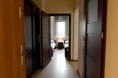 a hallway with two doors and a room with a bedroom at ANGELS A in Zator