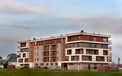a tall building with cars parked in front of it at ANGELS A in Zator