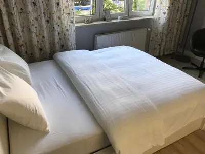 a white bed in a bedroom with a window at Apartment II GrayFor2 Old Town Kraków in Kraków