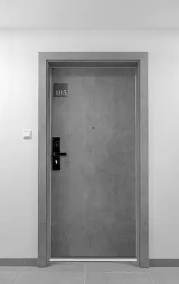 a metal door with the number on it at Native Apartments Rajska 3 in Kraków