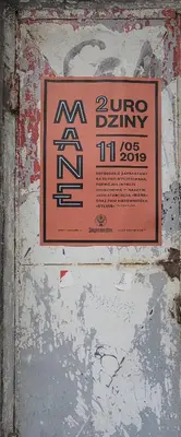 a sign on the side of a wall with graffiti at Native Apartments Rajska 3 in Kraków