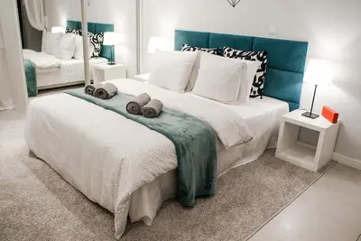 a bedroom with a large bed with two towels on it at Cozy Studio perfect for couples, Cracow Old Town in Kraków
