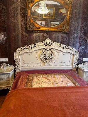a bedroom with a white bed with a mirror at Cracow. Villa Cherubin Garden in Kraków